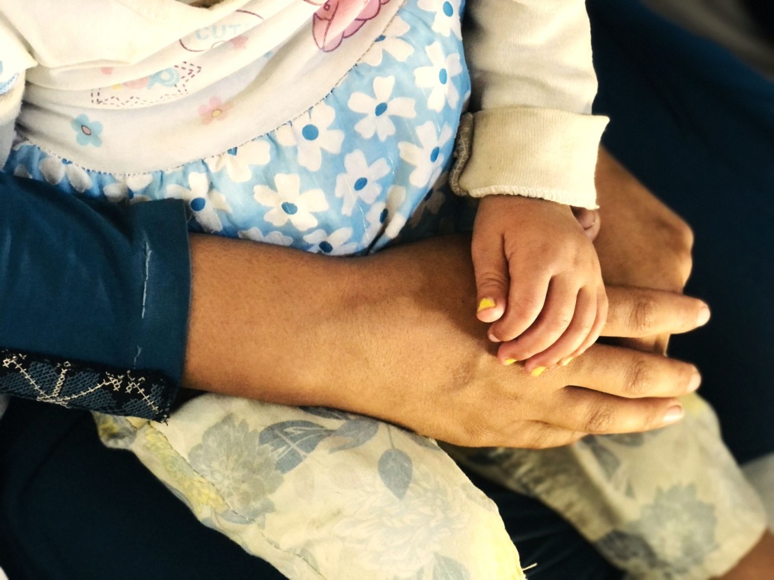 A mother holds her child at a Baby Safe Space.