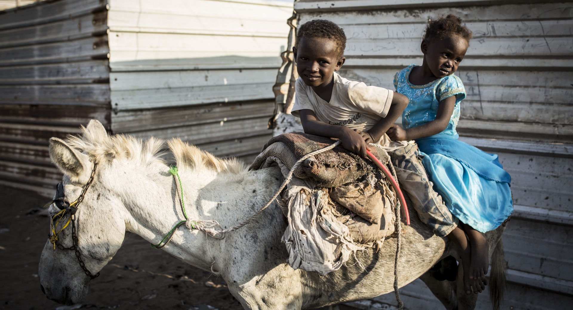 Two children on a donkey in Yemen
