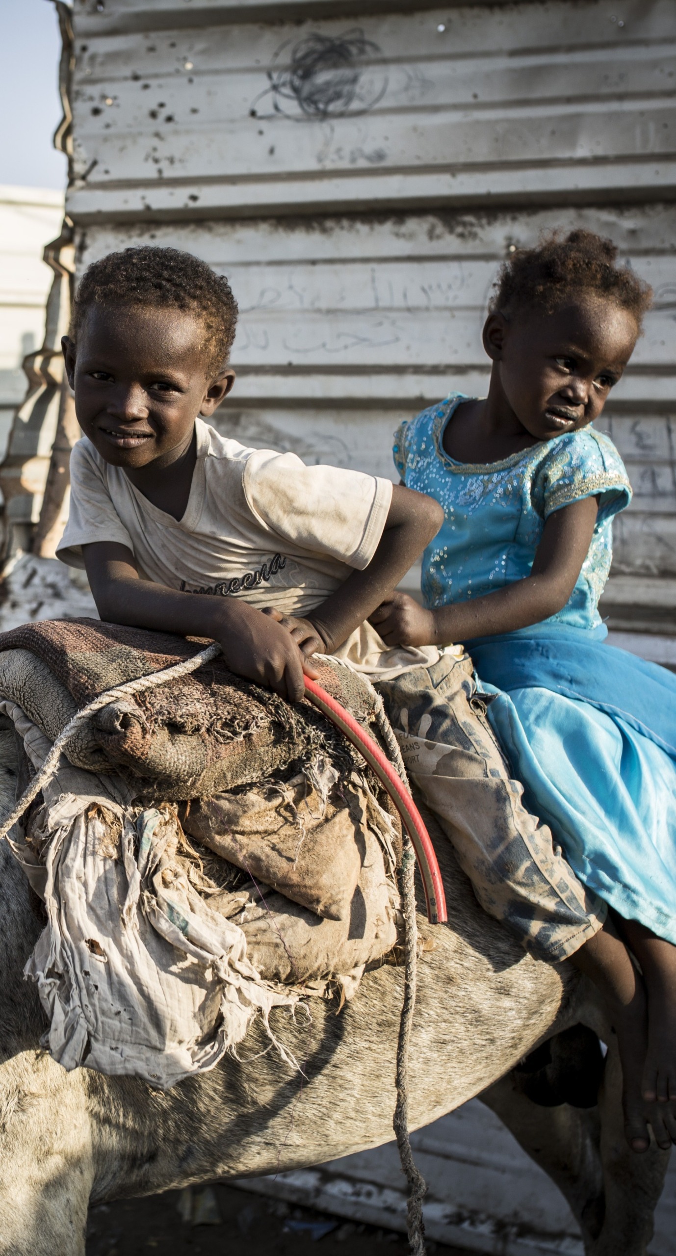 Two children on a donkey in Yemen