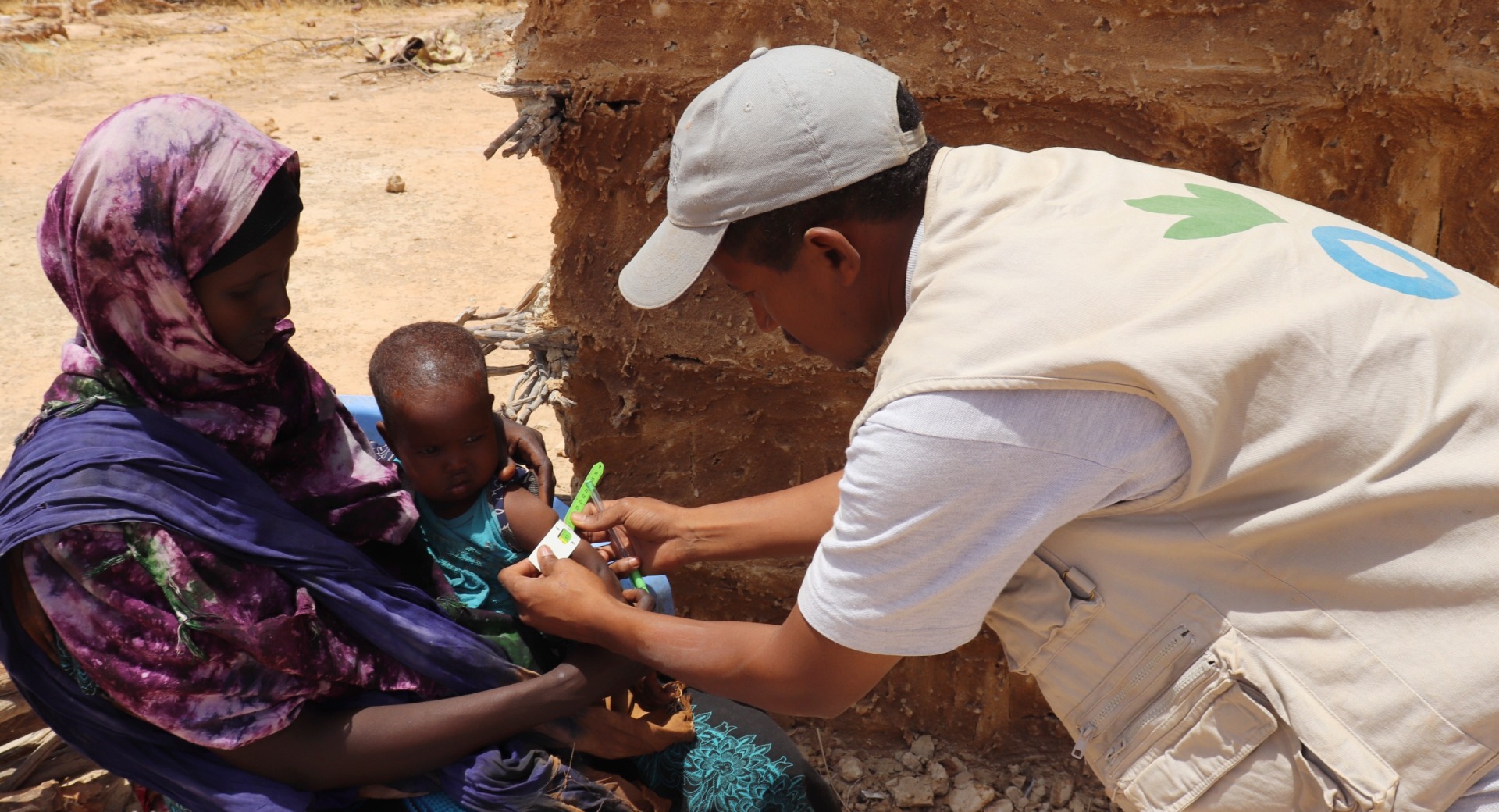 A child is screened for malnutrition.