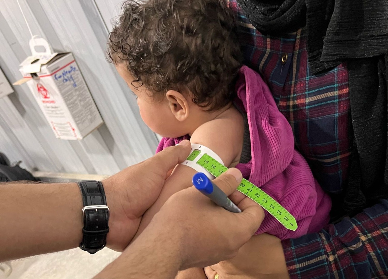 A child is screened for malnutrition in Gaza in April 2025.