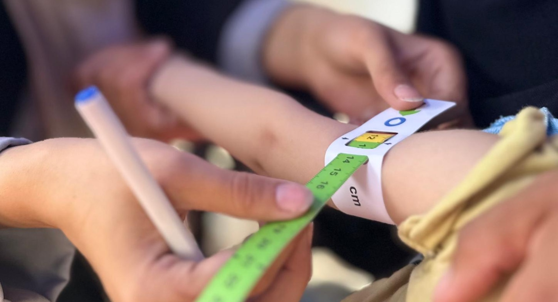 A child's upper arm is measured for malnutrition in Gaza.