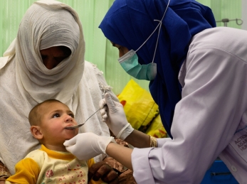 A nurse treats a two-year-old boy suffering from malnutrition and pneumonia at an Action Against Hunger Therapeutic Feeding Unit in Kabul, Afghanistan.