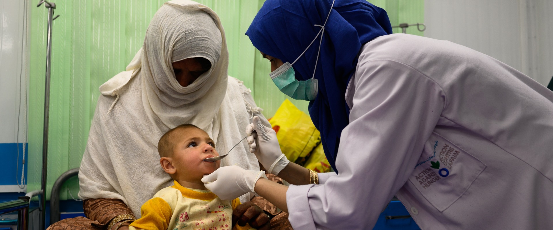 A nurse treats a two-year-old boy suffering from malnutrition and pneumonia at an Action Against Hunger Therapeutic Feeding Unit in Kabul, Afghanistan.