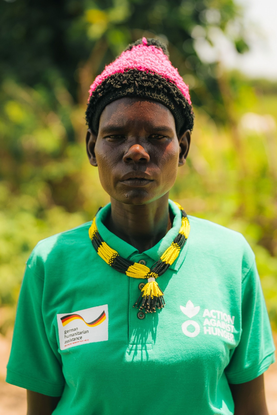Portrait of Aling in a green shirt.