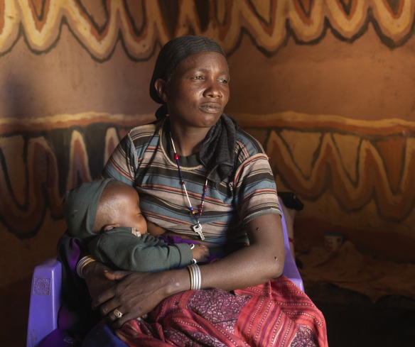 Loko Diba Boru, 35, with her baby boy Gelgalo, 10 months old, in Hidhi Miribi, Ethiopia.