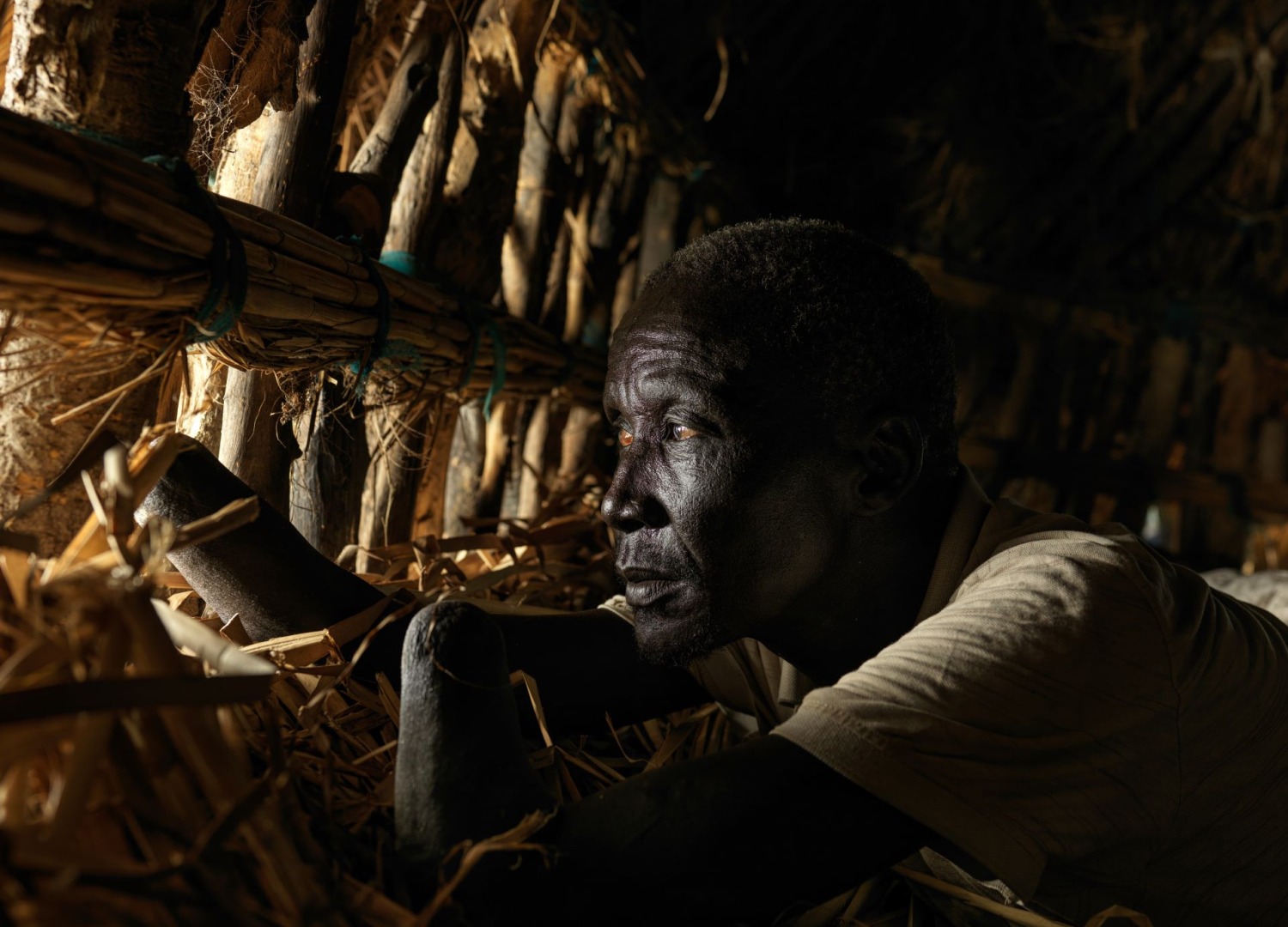 A man looking outside his home in South Sudan