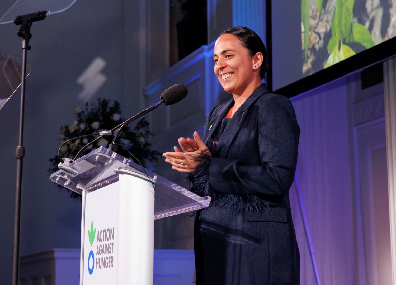 Farida “Frida” Gadzhimirzaeva speaking at Action Against Hunger's 2024 gala
