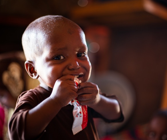 A young boy eating food
