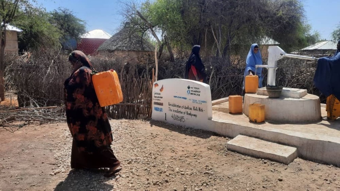 Owliya carries water home from the well