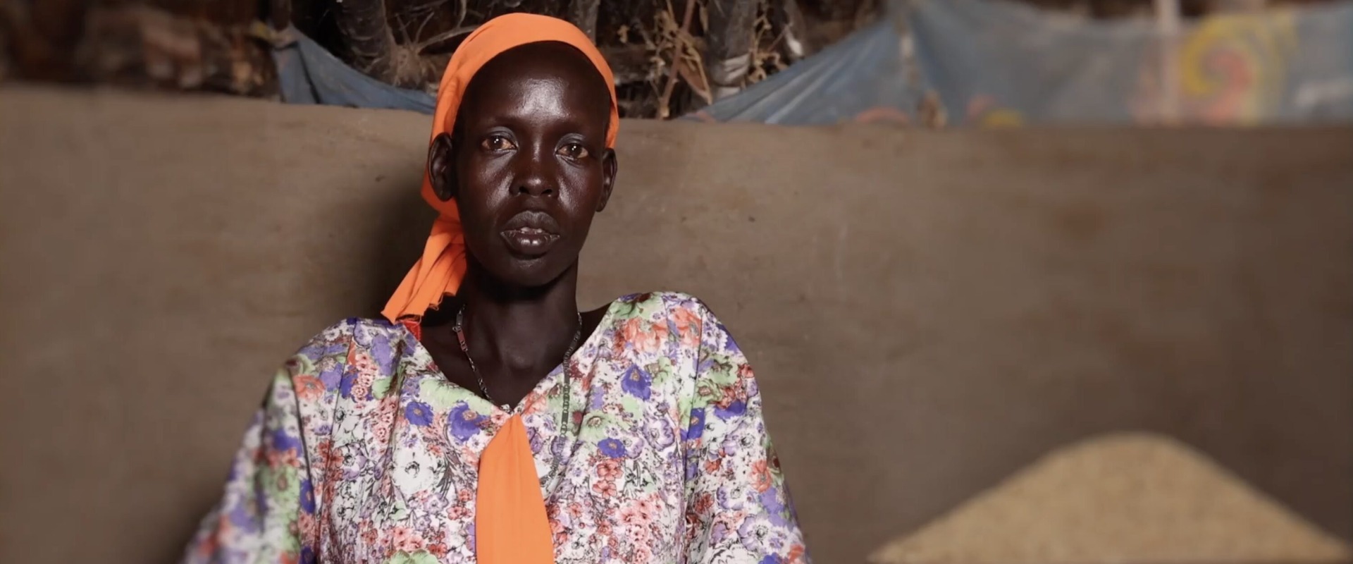 A woman looking into camera in South Sudan