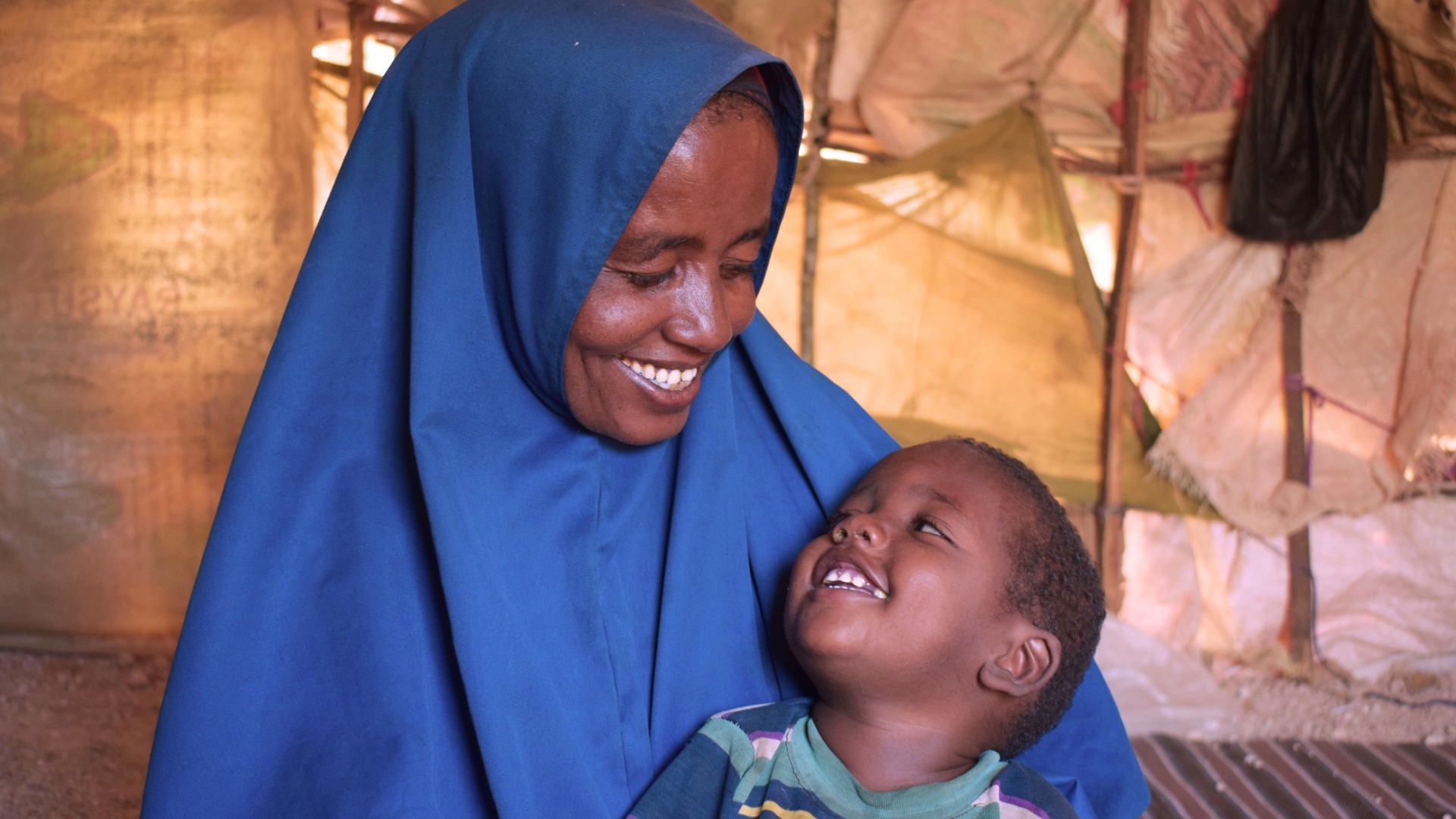 A happy mother and child look at each other