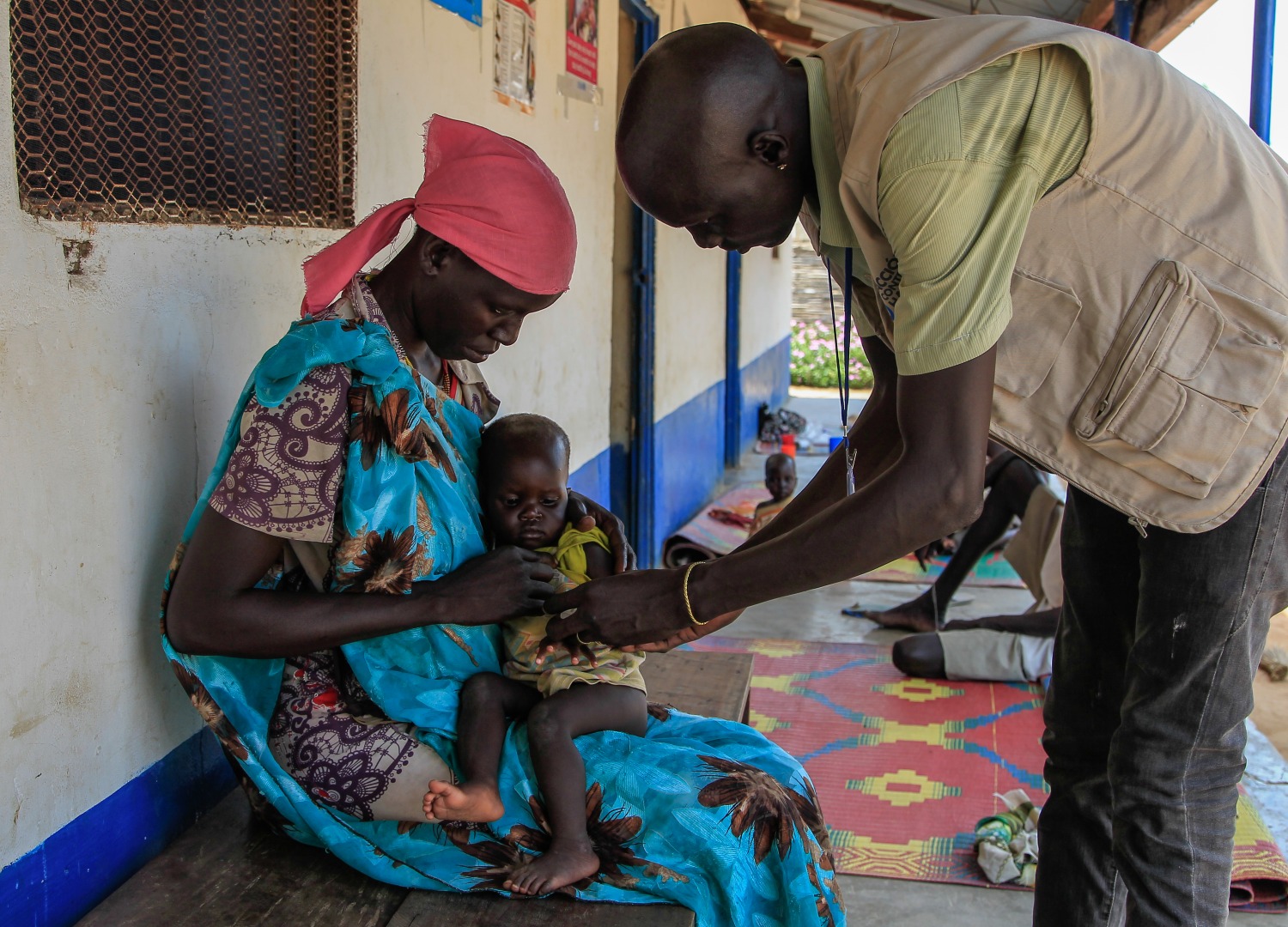Achoc and her one year old daughter Atong receive care at an Action Against Hunger nutrition center.