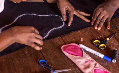 Students in Tanzania sew mentrural pads.