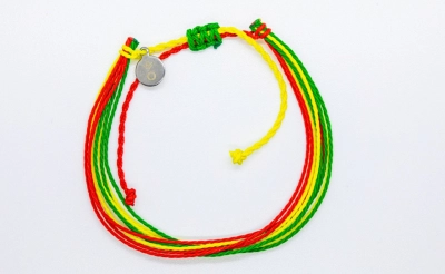 Bracelet with red, green, and yellow strings