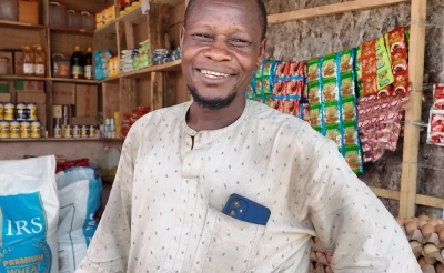 A man business owner in Nigeria smiling at the camera